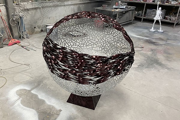 Custom Stainless Steel Hollow Sphere Sculpture with Dark Twisted Accent – Outdoor Modern Art  Custom Stainless Steel Hollow Sphere Sculpture with Dark Twisted Accent – Outdoor Modern Art